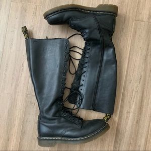 Black knee-high Dr. Martens boots